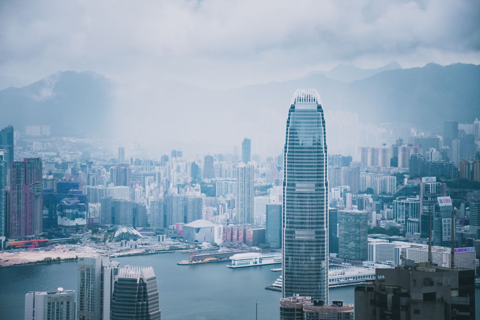 Panoramic view of Hong Kong's modern skyline featuring iconic skyscrapers and urban archit